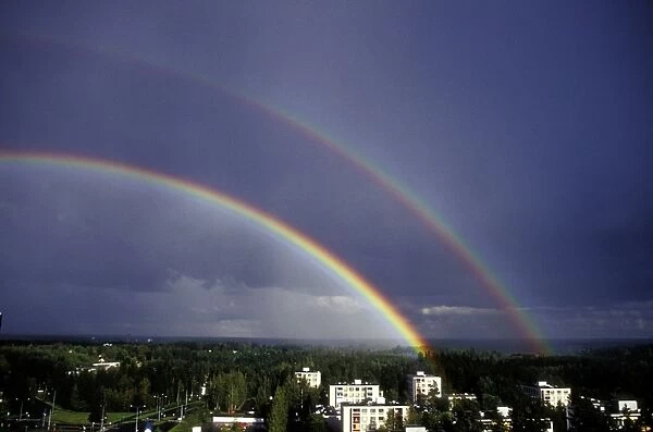 Double rainbow over a town