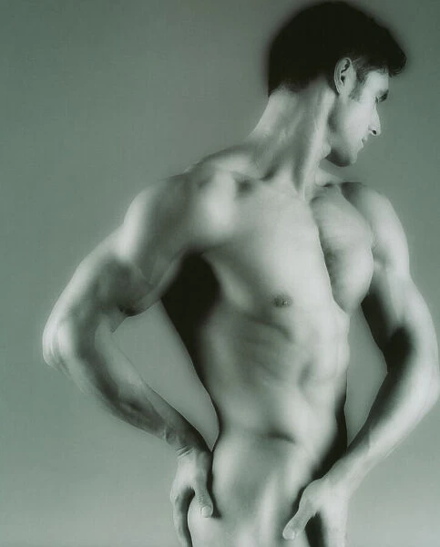 Nude man. MODEL RELEASED. Nude man seen from the side