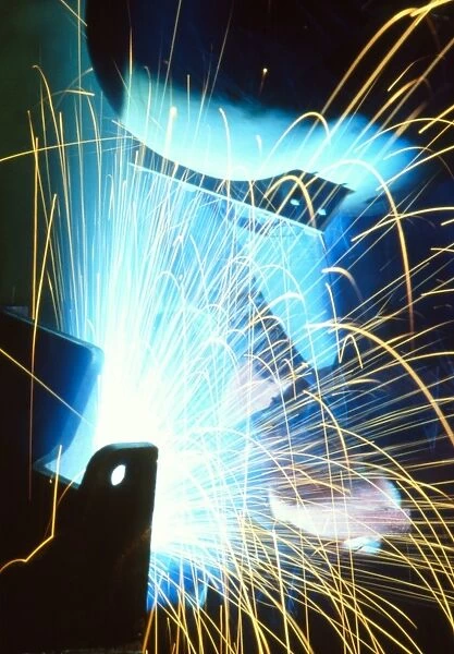 Sparks flying from an argon welder at work