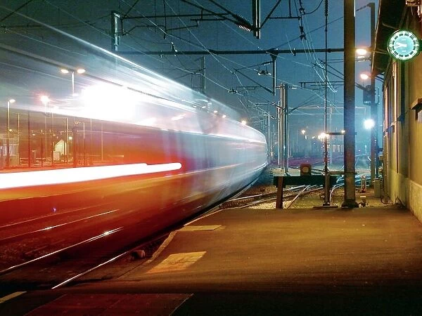 TGV train. Time-exposure image of a French high speed train passing through a station