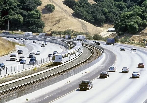 Train and motorway, California, USA