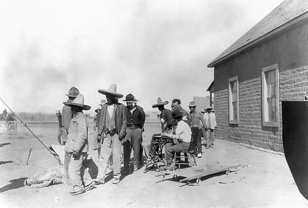 MEXICAN REFUGEES, 1914. U. S. soldiers interviewing Mexican refugees at Fort Bliss