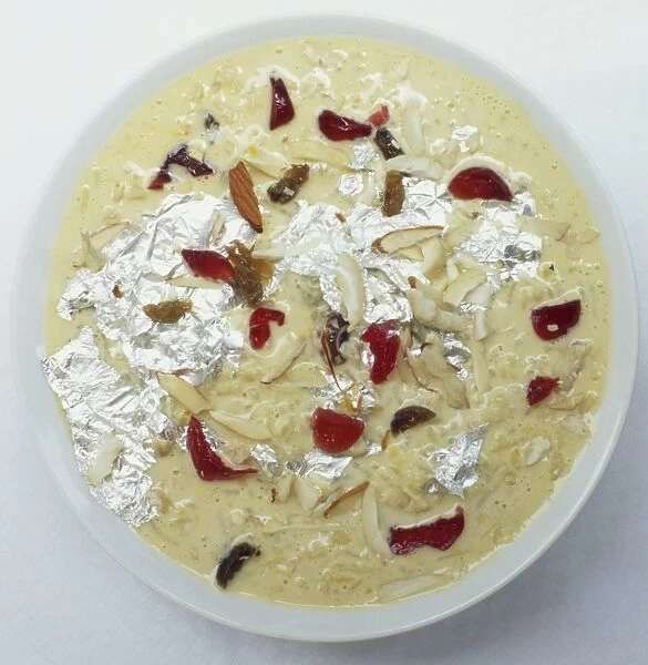 Kheer, Indian pudding made of rice and milk, elaborately garnished with candied fruits and sheets of beaten silver