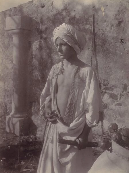Young Man White Robe Head Gear Holding Scabbard