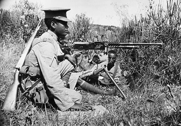 Abyssinian War September 1935 Abyssinian machine gunner firing an old Hotchkiss