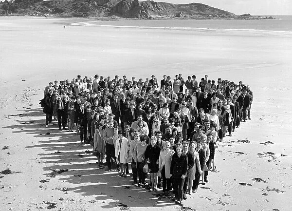 Honeymoon couples on the sunny Isle of Jersey. 140 couples gathered at St Brelades Bay