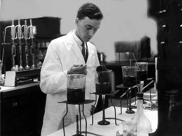 Science Bunsen Burner August 1926 A chemist testing dyes on woollen material in