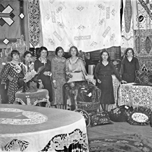 Women with display of homemade arts and crafts
