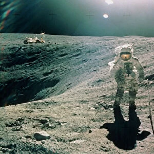 Astronaut Duke next to Plum Crater, Apollo 16