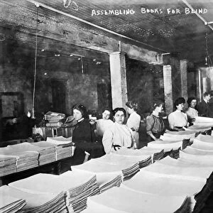 BOOKS FOR THE BLIND, c1900. Women workers assembling books in braille for the blind