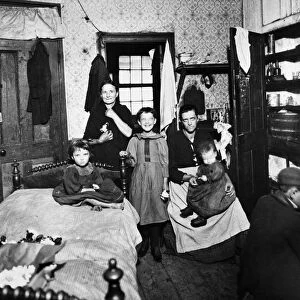 NEW YORK: SLUM, 1896. A family in their home on the Lower East Side of New York City