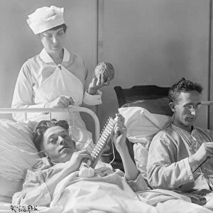 WALTER REED HOSPITAL, c1918. Wounded soldiers knitting in their beds at the Walter