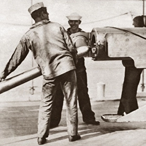 WORLD WAR I: U. S. NAVY. Sailors loading a naval gun on board a merchant ship during World War I