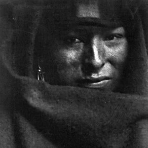 Photograph showing head-and-shoulders portrait of Native American man, 1902. Photographer