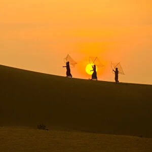 Minority Cham Girls on Sand Dune in beautiful sunsire / dawn