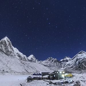 the Big Dipper rise above the Himalayas and the Gorak Shep settlement in Nepal