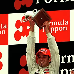 2003 Formula Nippon Championship Fuji, Japan. 31st August 2003. Race winner Benoit Treluye (IMPUL), podium. World Copyright: Yasushi Ishihara/LAT Photographic ref: Digital Image Only