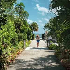 Florida, Miami, Villa Vizcaya, woman walking towards water