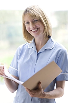 Nurse checking notes