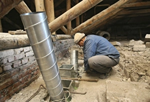 Wood Prints: Worker installing ventilation